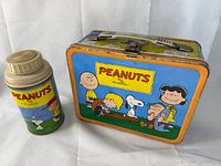 Lunchbox front with thermos bottle side by side