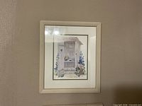 both framed prints hanging on wall