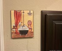 Front view of bath themed canvas art on wall