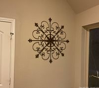 Full view of metal wall crest mounted on wall