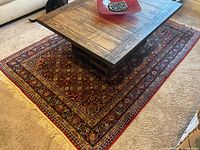 Full view of coffee table on rug