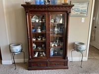 Full view of wood china cabinet showing structure, doors, drawers and shelves