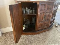 Cabinet door open showing interior shelf construction