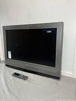 Front view of Symphonic 32-inch TV and remote