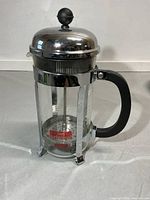 Full view of Bodum french press showing lid, handle, frame and overall condition