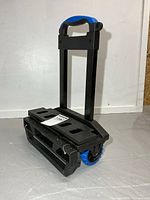 Overall view of folded cart with handle extended