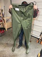 full view of green chest waders held up
