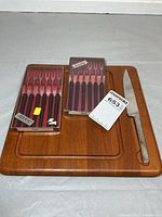board, knife, two fork sets in packaging
