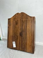 Front view of closed wood cabinet