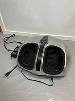 Overall view of Belmint foot massager showing dual foot wells and attached power cord