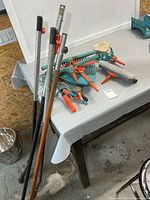 Overall lot on table showing handles and tool heads