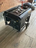 Front angled view showing Steele generator frame, wheels, and engine