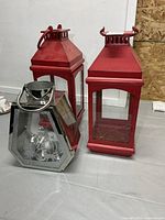 Front view showing two red lanterns and one silver lantern