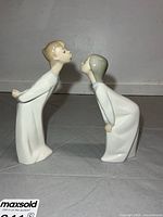 Front view of both Lladro figurines facing each other