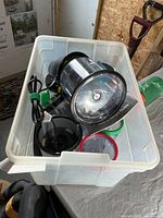 Plastic tote containing Ninja motor pod, processor bowl, Magic Bullet components