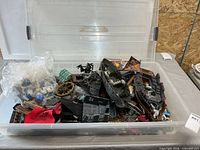 Overall view of clear tote with mixed Mega Bloks ship parts and bricks