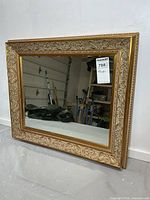 Front view of ornate framed mirror showing full design