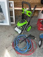 Pressure washer with both hoses and wand visible