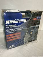 Front of sealed box showing brand, product name, image of nailer