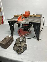 Overall view of router table, router, bit case, base plate