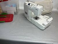 Brother SE-350 machine with bin, lids and fabric cover