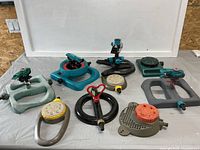 All nine sprinklers laid out showing variety of styles and colors