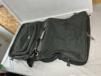 Full view of unfolded garment bag showing size and features