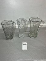 All three clear glass vases side by side