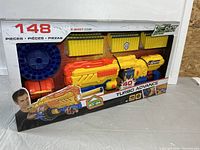 Front view of sealed X-Shot Turbo Advance box showing blaster and included darts