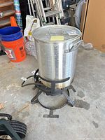 complete turkey fryer setup showing pot on burner stand