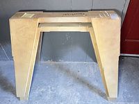 Front view of plywood sawhorse standing upright