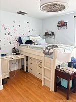 Full loft bed showing drawers, ladder and desk