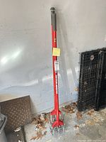 Full view of Garden Weasel spike aerator standing upright