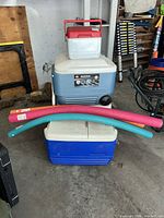 Group shot of both coolers and three pool noodles