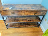 Front view showing full console table, drawers, shelf, overall style and finish