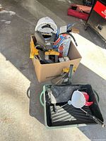 Box with paint tools, trays, funnels, clamps