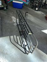 Overall view of carrier folded flat on garage floor