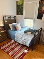 Overall view of twin bed frame with headboard, footboard, side rails visible