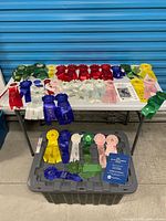 Overview of entire ribbon collection on table and bin