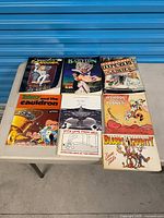 All eight comic books laid out on table