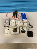 Overview of entire lot including microphones, earbud boxes and accessories