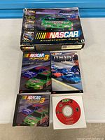Full lot showing box, two manuals, and single CD