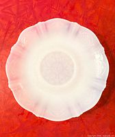 Top view of one Monax American Sweetheart bread plate showing scalloped rim and embossed pattern