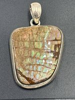 Front view showing ammolite colors and bezel