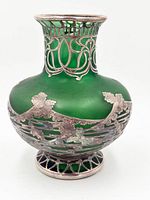 Front view showing green satin glass body and silver overlay