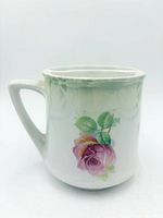 Left side view showing handle and rose decal