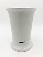 Front view of white ceramic brush holder