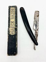 Straight razor beside original Marck Razor box