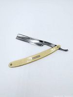 Straight razor open showing blade and handle