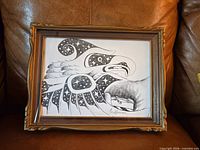 Front view of framed eagle drawing showing artwork details and frame